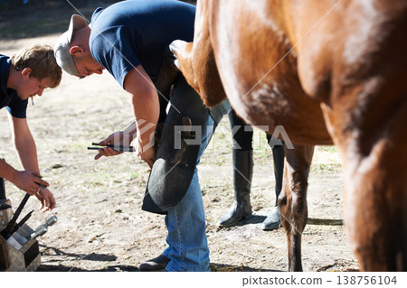 Farrier men, horse hooves and farm with help for running, race and speed with tools, care and support. Vet team, equine doctor and healthcare for animal, pet and together at ranch in countryside Farrier men, horse hooves and farm with help for running, race and speed with tools, care and support. Vet team, equine doctor and healthcare for animal, pet and together at ranch in countryside 138756104
