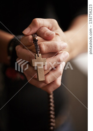 Hands, prayer with beads and worship for religion, trust and spiritual wellness with hope, peace and love. Support, mindfulness and person in Christian faith praying, gratitude and rosary with cross. 138756223