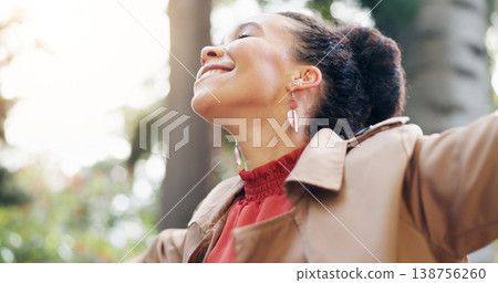 Freedom, happy and business woman in a park with vacation, celebration or positive mindset outdoor. Smile, energy and female entrepreneur in a forest for holiday, fresh air and excited in nature Freedom, happy and business woman in a park with vacation, celebration or positive mindset outdoor. Smile, energy and female entrepreneur in a forest for holiday, fresh air and excited in nature 138756260
