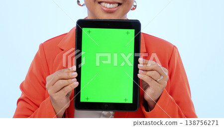 Woman, hands and tablet with green screen in studio by blue background. Female model, tracking markers and chroma key on digital device, technology and display or promotion, online and mock up Woman, hands and tablet with green screen in studio by blue background. Female model, tracking markers and chroma key on digital device, technology and display or promotion, online and mock up 138756271