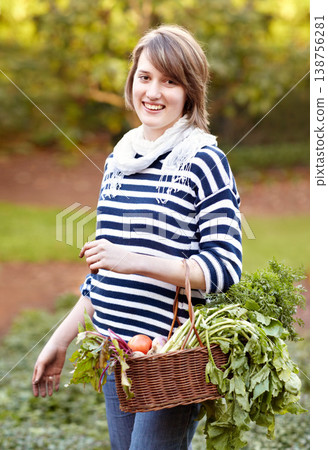 Harvest, basket and portrait of woman with vegetables from gardening in backyard. Happy, person and container with healthy produce, fruits or plants from farming agriculture or garden in countryside Harvest, basket and portrait of woman with vegetables from gardening in backyard. Happy, person and container with healthy produce, fruits or plants from farming agriculture or garden in countryside 138756281