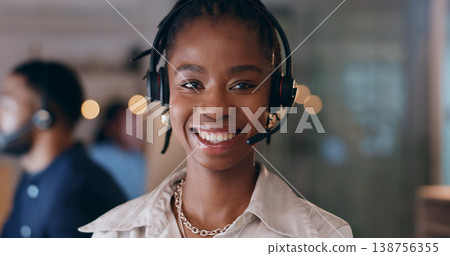 Portrait, smile and black woman at call center on headphones for crm support on bokeh at night. Face, happy sales agent and telemarketing consultant, customer service professional or worker in office Portrait, smile and black woman at call center on headphones for crm support on bokeh at night. Face, happy sales agent and telemarketing consultant, customer service professional or worker in office 138756355