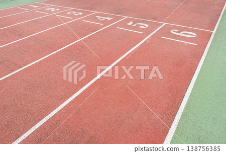 a Red Running Track with White Lane Markings 138756385