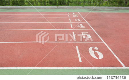 a Red Running Track with White Lane Markings a Red Running Track with White Lane Markings 138756386