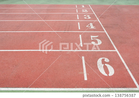 a Red Running Track with White Lane Markings 138756387