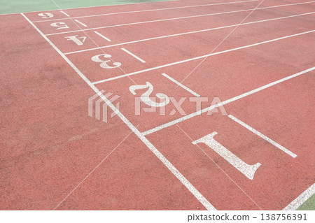 a Red Running Track with White Lane Markings 138756391