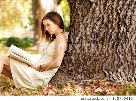 Woman, book and reading outdoors for fun, peace and calm in nature for travel adventure in New York. Happy female person, freedom and break by tree, literature and fiction in park, story or novel 138756416
