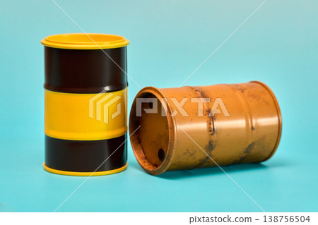 Two Cylindrical Barrels on Blue Background Two Cylindrical Barrels on Blue Background 138756504