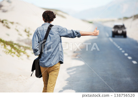 Man, travel or hitchhiking on highway for car, stop or adventure on road trip with transportation for freedom. Young person, summer or countryside for help with journey, cape town or outdoor Man, travel or hitchhiking on highway for car, stop or adventure on road trip with transportation for freedom. Young person, summer or countryside for help with journey, cape town or outdoor 138756520