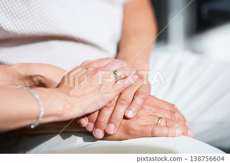 Marriage, holding hands or old couple with support, trust or hope in commitment together at home. Zoom, wedding ring or senior man bonding to relax with a mature woman on anniversary for love or care Marriage, holding hands or old couple with support, trust or hope in commitment together at home. Zoom, wedding ring or senior man bonding to relax with a mature woman on anniversary for love or care 138756604