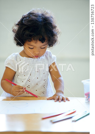 Young girl, drawing and classroom for creative development, education growth in kindergarten. Child, daycare and table pencils artwork for learning play in school or paper crayons, kid craft or color Young girl, drawing and classroom for creative development, education growth in kindergarten. Child, daycare and table pencils artwork for learning play in school or paper crayons, kid craft or color 138756723