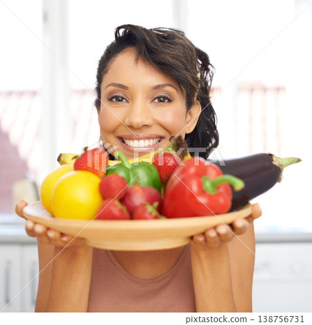 Portrait, cooking and vegetables with a woman in the kitchen of her home for nutrition, diet or meal preparation. Face, ingredients and a recipe for health food with a young person in her apartment 138756731