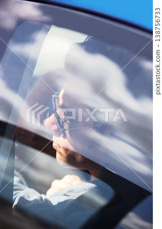 Window, reflection and a man driving a car on the open road for travel or a journey while on holiday. Glass, luxury and transport with a young person on a commute or trip in a vehicle for adventure 138756733
