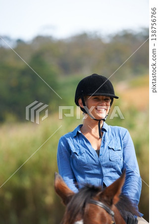 Woman, horse riding outdoor and happy in portrait with helmet, ranger or exercise with equine pet. Girl, jockey and animal with smile on adventure, training or learning for competition in countryside Woman, horse riding outdoor and happy in portrait with helmet, ranger or exercise with equine pet. Girl, jockey and animal with smile on adventure, training or learning for competition in countryside 138756766