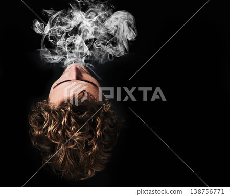 Man smoking marijuana, drugs or cigarette in studio isolated on black background mockup. Smoke, vape and person exhale cannabis, weed and addiction to tobacco, 420 cbd or substance abuse in top view Man smoking marijuana, drugs or cigarette in studio isolated on black background mockup. Smoke, vape and person exhale cannabis, weed and addiction to tobacco, 420 cbd or substance abuse in top view 138756771
