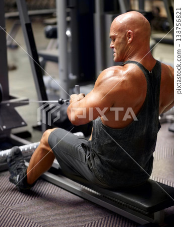 Rowing machine, man and gym fitness with arm strength, power and muscle exercise for health and wellness. Weight lifting and male athlete with strong bodybuilder and gym workout for sport training Rowing machine, man and gym fitness with arm strength, power and muscle exercise for health and wellness. Weight lifting and male athlete with strong bodybuilder and gym workout for sport training 138756821