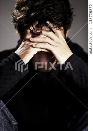 Man, sad or depression with mental health and thinking about pain, stress or burnout with financial crisis and life. Hands, trauma in studio and bankruptcy with debt and disaster on grey background 138756876