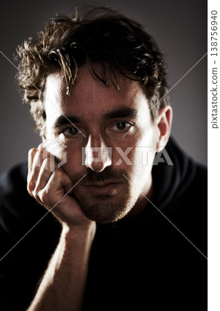 Man, depression and portrait, sad with mental health and crisis in studio, feelings and grief on grey background. Pain, wellness and depressed, trauma or abuse, distress and upset with psychology Man, depression and portrait, sad with mental health and crisis in studio, feelings and grief on grey background. Pain, wellness and depressed, trauma or abuse, distress and upset with psychology 138756940