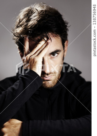 Sad, portrait and a man with depression on a studio background for mental health or mindset. Stress, frustrated and a person with anxiety, fail or a mistake with a disaster or crisis on a backdrop 138756948