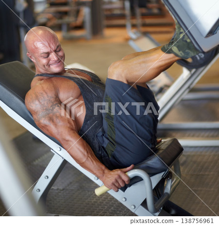 Leg press, man and fitness at gym with bodybuilder, cardio and muscle power at health club. Wellness, athlete and exercise machine with heavy weight and strain from bodybuilding, sport and workout Leg press, man and fitness at gym with bodybuilder, cardio and muscle power at health club. Wellness, athlete and exercise machine with heavy weight and strain from bodybuilding, sport and workout 138756961