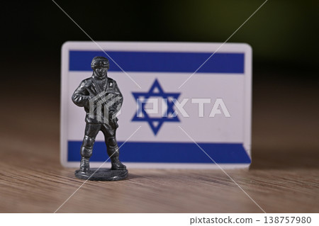 A tin soldier on the background of the Israel flag. 138757980