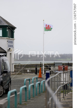 Welsh flag flying over caernarfon bank quay dock Welsh flag flying over caernarfon bank quay dock 138757997