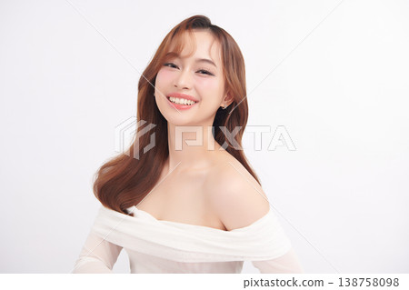 A beautiful young Asian woman with clean, fresh skin against a white background. Skincare, facial treatment, cosmetology, beauty, and spa. An elegant portrait of an Asian woman. A beautiful young Asian woman with clean, fresh skin against a white background. Skincare, facial treatment, cosmetology, beauty, and spa. An elegant portrait of an Asian woman. 138758098