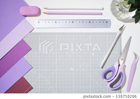 Workspace for design, DIY and paper art projects. Scissors, ruler, pencils and craft tools on cutting mat. Copyspace 138758206