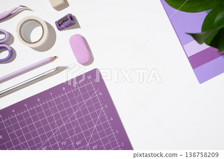 Purple cutting mat layout with craft tools and stationery on white background with copy space. DIY concept. 138758209