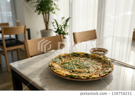 Korean Chive Pancake on Marble Table with Natural Light Korean Chive Pancake on Marble Table with Natural Light 138758231