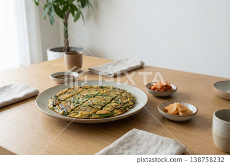 Korean Chive Pancake with Side Dishes on Wooden Table Korean Chive Pancake with Side Dishes on Wooden Table 138758232