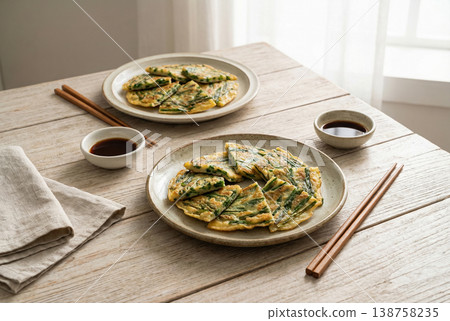 Korean Chive Pancake Served on Rustic Wooden Table with Sauce Korean Chive Pancake Served on Rustic Wooden Table with Sauce 138758235