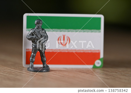 A tin soldier on the background of the Iranian flag. A tin soldier on the background of the Iranian flag. 138758342