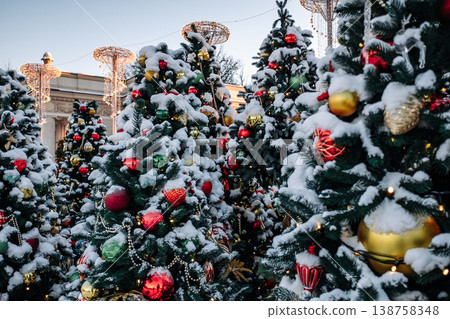 Christmas tree and New Year decorations on the town square on a frosty winter day. Christmas tree and New Year decorations on the town square on a frosty winter day. 138758348