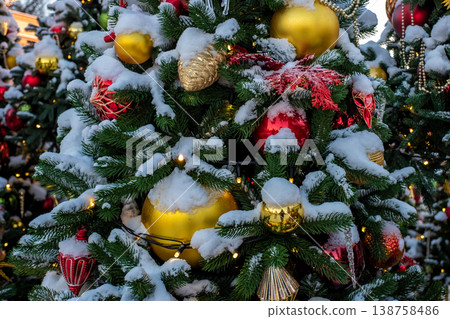 Christmas tree and New Year decorations on the town square on a frosty winter day. Christmas tree and New Year decorations on the town square on a frosty winter day. 138758486