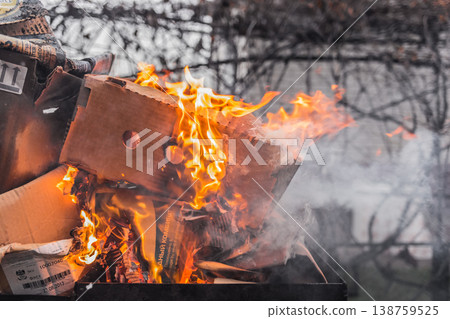 Burning cardboard boxes, disposal of old cardboard and paper waste Burning cardboard boxes, disposal of old cardboard and paper waste 138759525