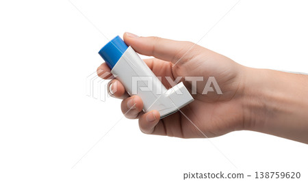 Hand holding standard blue asthma inhaler metered-dose inhaler, representing respiratory relief, lung health, and asthma management Hand holding standard blue asthma inhaler metered-dose inhaler, representing respiratory relief, lung health, and asthma management 138759620