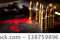 Rifle cartridges on dark tactical surface with red world map and handgun grip visible 138759896