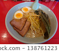 Spicy green onion ramen with a boiled egg topping 138761223