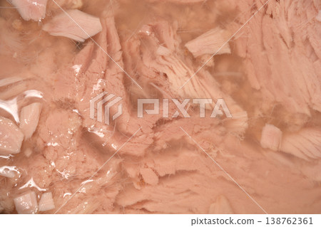 Close up of canned tuna pieces in brine Close up of canned tuna pieces in brine 138762361
