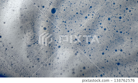 Bubbles forming in a mixture at a cleaning or washing activity in bright light Bubbles forming in a mixture at a cleaning or washing activity in bright light 138762576