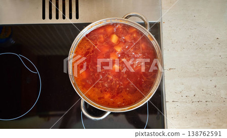 homemade borscht is cooked in a saucepan on a home stove homemade borscht is cooked in a saucepan on a home stove 138762591