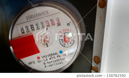Water meter showing usage readings in a residential location Water meter showing usage readings in a residential location 138762592