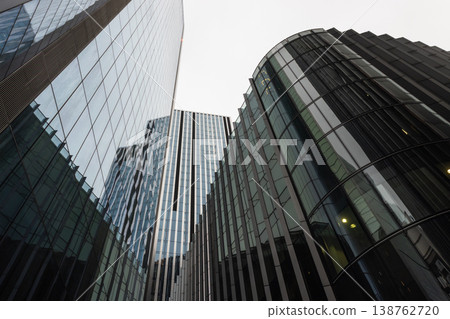 Modern urban architecture with curved glass facades in the city Modern urban architecture with curved glass facades in the city 138762720