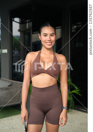 Fit Thai Woman in Brown Halter Gym Set Posing After Workout Gym Training Done Concept Fit Thai Woman in Brown Halter Gym Set Posing After Workout Gym Training Done Concept 138762887
