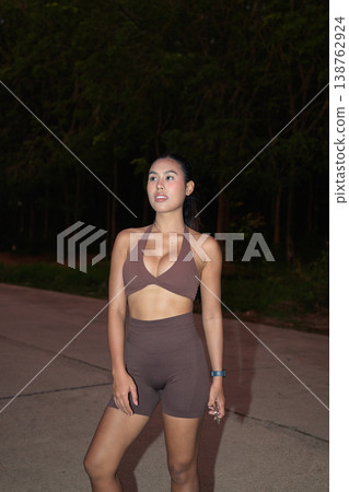 Thai Fitness Influencer Posing on Road After Evening Training Healthy Lifestyle Concept Thai Fitness Influencer Posing on Road After Evening Training Healthy Lifestyle Concept 138762924