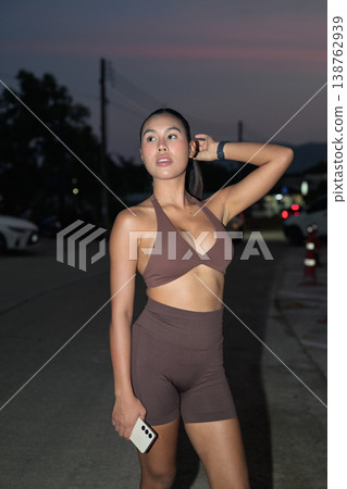Thai Fitness Influencer Posing on Street at Dusk Healthy Lifestyle Concept 138762939