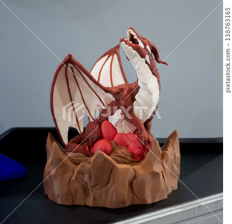 3D printed art object. Art object printed on 3D printer from melted colored plastic. Model in shape dragon created on 3D printer from threads molten plastic. Modern additive progressive technologies 3D printed art object. Art object printed on 3D printer from melted colored plastic. Model in shape dragon created on 3D printer from threads molten plastic. Modern additive progressive technologies 138763165
