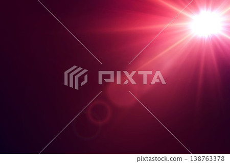 Bright red light flare illuminating dark background with glowing rays and bokeh elements Bright red light flare illuminating dark background with glowing rays and bokeh elements 138763378