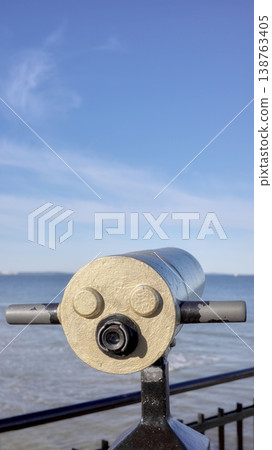 Viewing scope at a viewpoint facing the sea, selective focus. Viewing scope at a viewpoint facing the sea, selective focus. 138763405